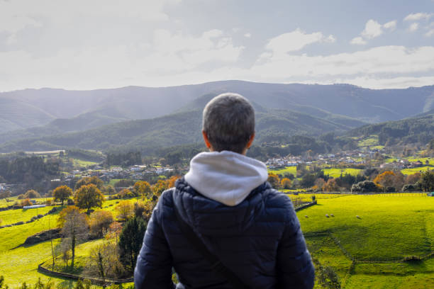 istock Mature woman enjoying scenic fall view 1888166870
