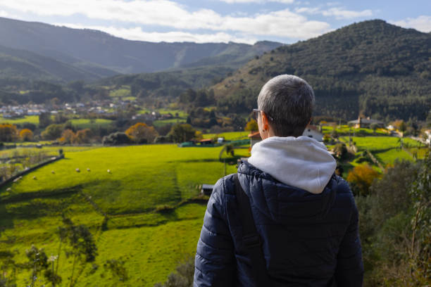 istock Mature woman enjoying scenic fall view 1888167377