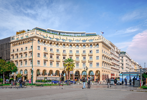 Thessaloniki, Greece - November 26 2023: Aristotelous Square, the main city square on Nikis avenue (on the waterfront), in the city center. The iconic Electra Palace Hotel dominates the picture.