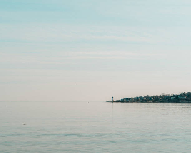 Free Stock Photo of Calm coastal view with a distant lighthouse ...