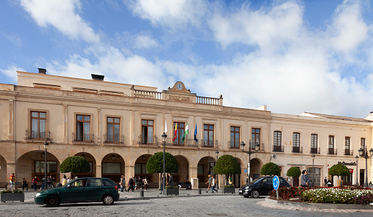 Exterior of the Parador de Ronda, in the Plaza de España of the historic centre of the town of Ronda. Paradors are state-run luxury hotels, located in historic buildings. The Ronda Parador dates from 1761, and was previously the Town Hall. Next door is a pharmacy and then a McDonald's.