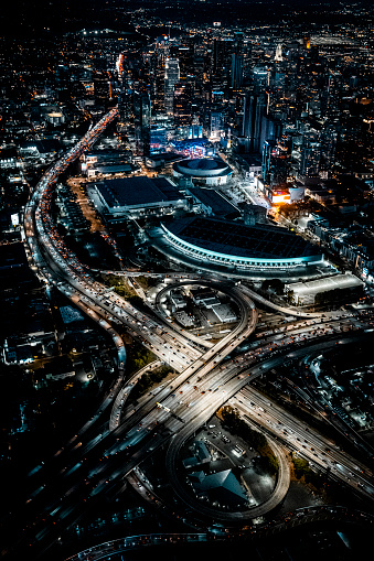 Helicopter point of view of Los Angeles highway interchanges at blue hour.