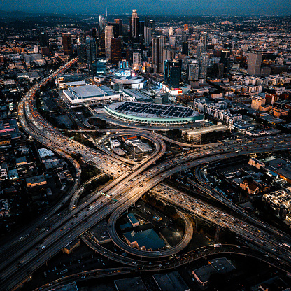 Helicopter point of view of Los Angeles highway interchanges at blue hour.