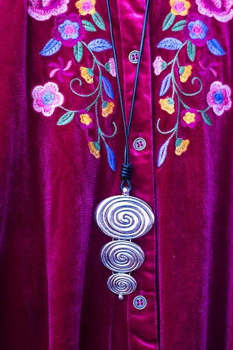 Colorful Floral Velvet Blouse and Necklace (Close-Up Detail)