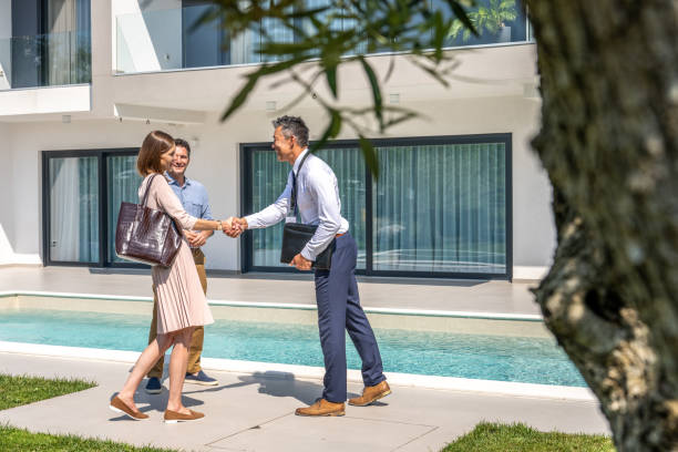 istock Real estate agent shaking hands with property buyers 1888325813