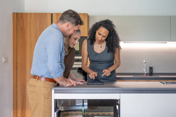 istock Real estate agent discussing catalog with clients 1888325825