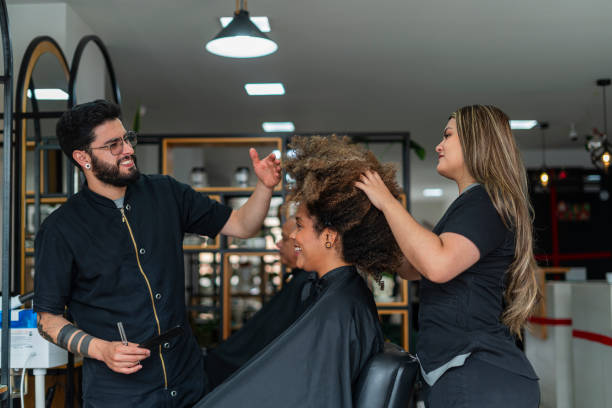 istock Woman is preparing her client's hair for a cut 1888329225