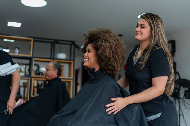 istock Woman is preparing her client's hair for a cut 1888331242