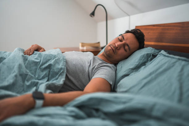 istock Attractive  Multiracial  Man Sleeping in Bed in the Morning 1888342530