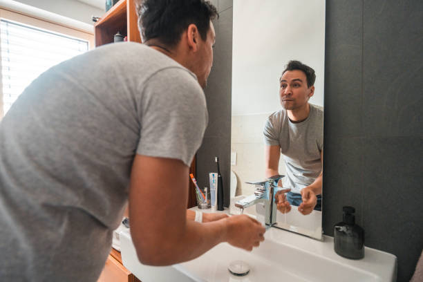 istock Casually Dressed Mid Adult  Man During His Morning Routine  in Bathroom 1888342599