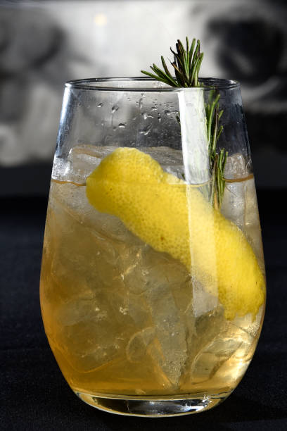 istock refreshing alcoholic drink with berries, ice vodka and gin, lemon peel served in glass cup on the counter on blurred background 1888384619