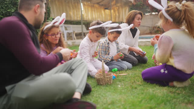 Group of children and parents gathering at family garden for Easter event