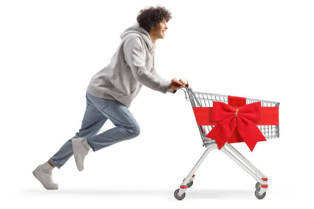 istock Young man running with decorated shopping cart 1888447438