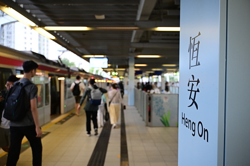 Osaka, Japan - April 1, 2012: Umeda area around the Hanku station with a view over the Yodobashi Camera building. Many pedestrians can be seen on various walkways.