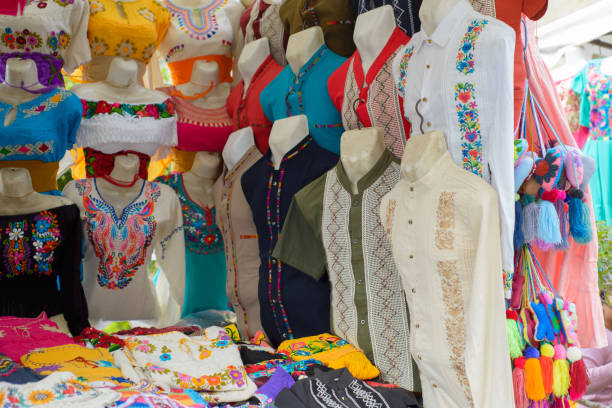 traditional mexican clothing with handmade embroidery. stall in a market in mexico. - mexico dress market clothing imagens e fotografias de stock
