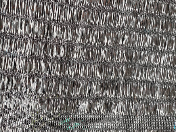 istock Sun Shade Net, Slan fabric used to filter the light for the plants pattern for background. 1888537728
