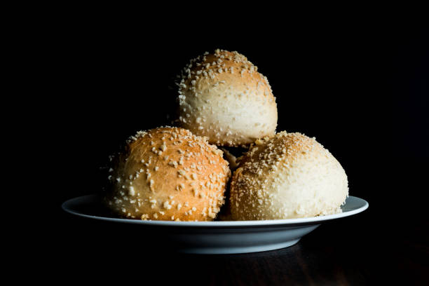 Bun burger puffy soft buns baking fresh delicious gourmet food background on the table rustic food top view copy space
