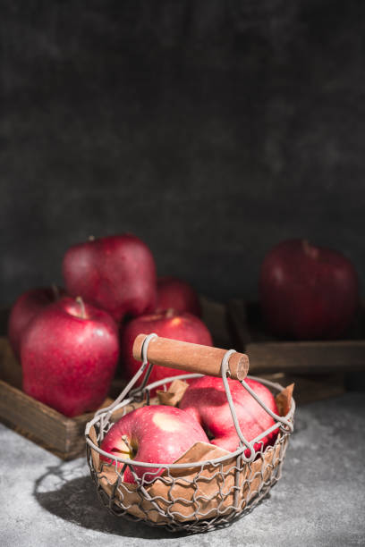 istock red apples in a wicker basket on dark background 1888724772