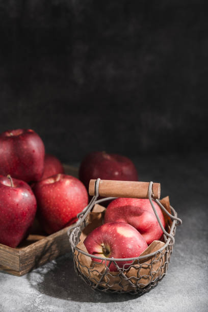 istock red apples in a wicker basket on dark background 1888727338