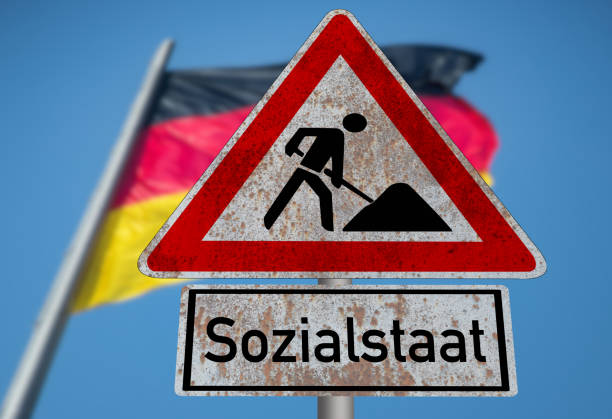 istock Flag of Germany and shield construction site welfare state 1888768147
