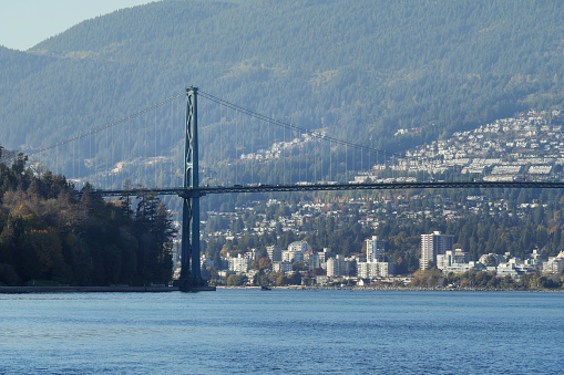 Beautiful view of the Lions Gate Bridge connecting the North Shore with Downtown Vancouver as seen from Stanley Park during a fall season in Vancouver, British Columbia, Canada.