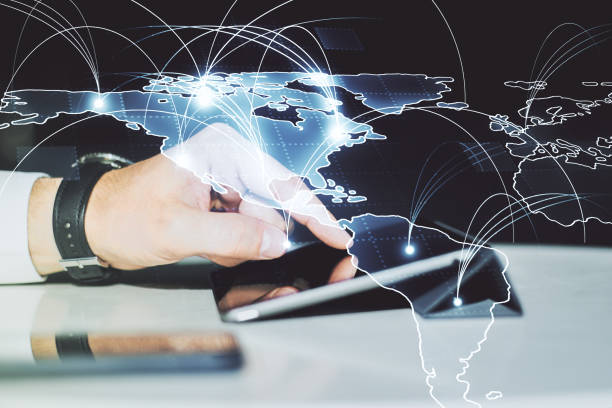 istock Double exposure of abstract digital world map with connections and hand working with a digital tablet on background, big data and blockchain concept 1888768919