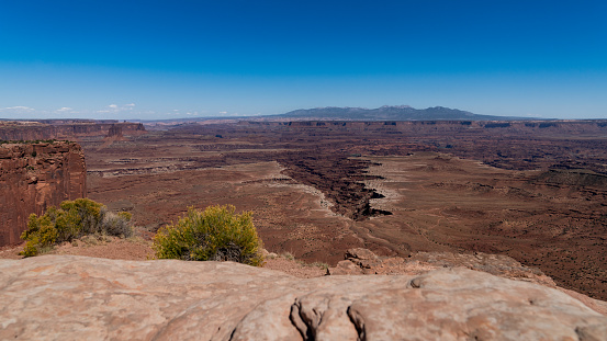 Large crack in the ground creating a large valley in Canyonlands National Park in Southern Utah