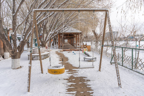Winter country playground swings