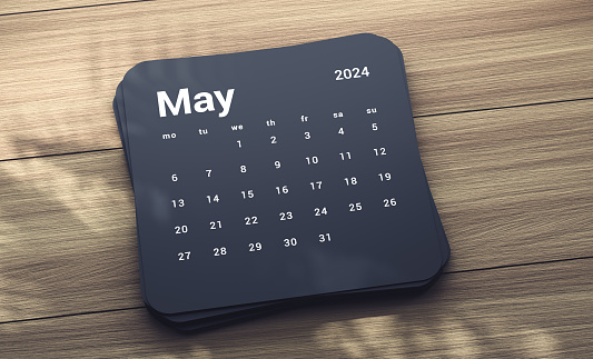 2024 May Calendar On Wood table with tree shadow