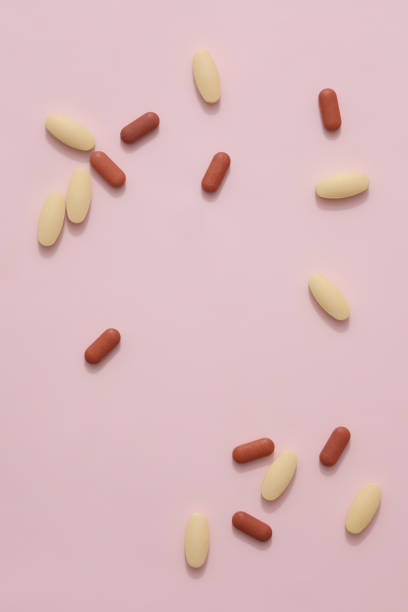 istock The tablets are randomly displayed on a pastel pink background. Empty space for text design. Tablets are a popular form and a low-cost way to make medicine but ensure safety and effectiveness 1888912171