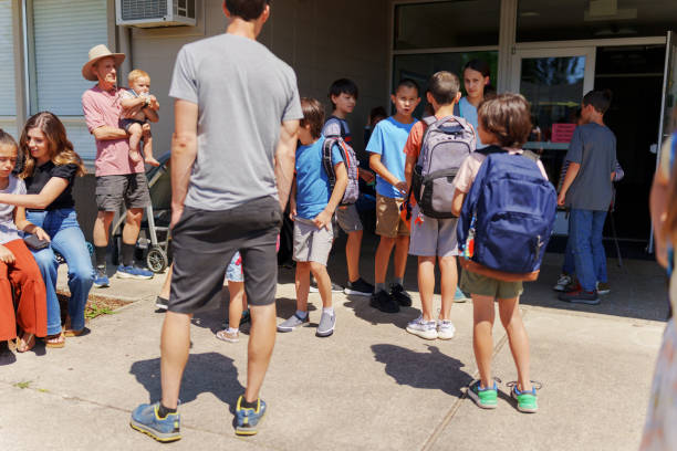 istock Elementary age kids being dropped off for school 1888915303