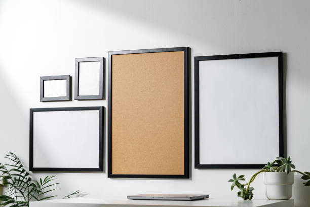 istock Set of black frames on white wall with copy space 1888948217