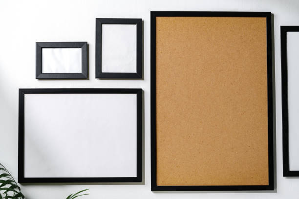 istock Set of black frames on white wall with copy space 1888968549