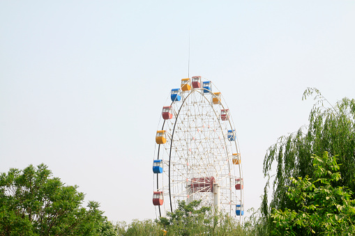ferris wheel in a park, closeup of photo