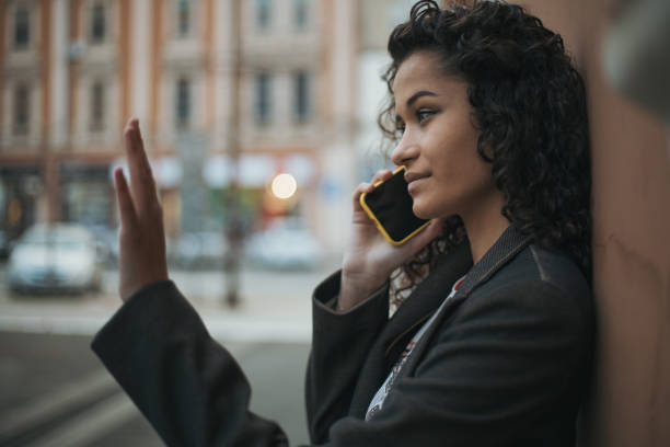 istock Beautiful girl calling a cab 1888987539