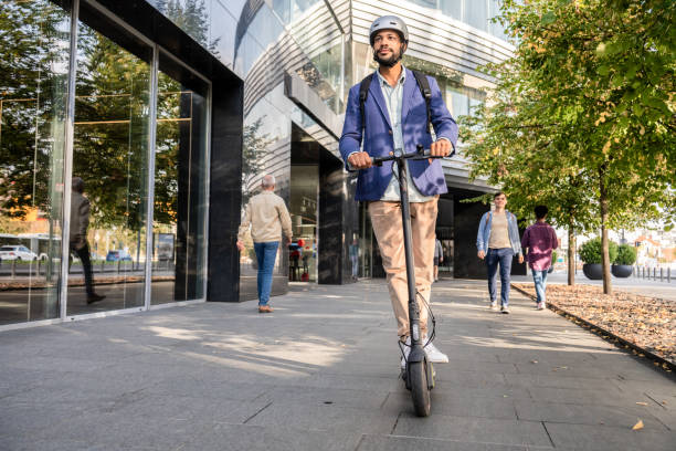 Man riding his e-scooter on road in city