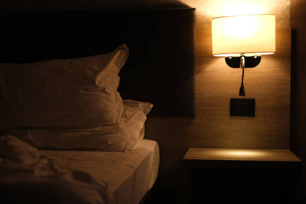 istock night light above the bed in a modern hotel room interior 1889007361