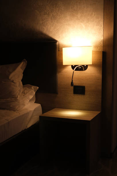 istock night light above the bed in a modern hotel room interior 1889008401