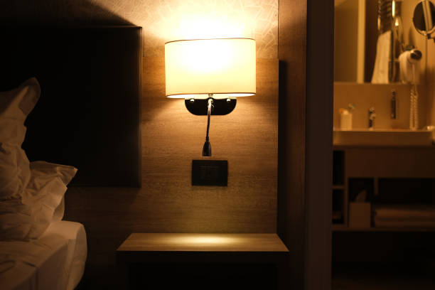 istock night light above the bed in a modern hotel room interior 1889008980