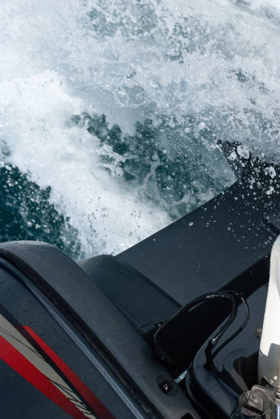 istock Outboard Engine Lower Unit and Propeller at Full Throttle: High-Speed Wake Creation in Sea 1889029641