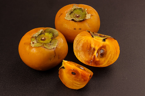 Ripe Persimmon Fruit Isolated on Table.