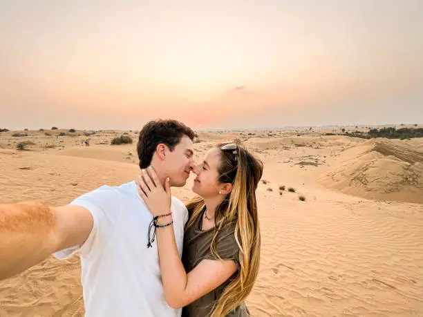 Photo of Selfie of a young couple in the Dubai desert