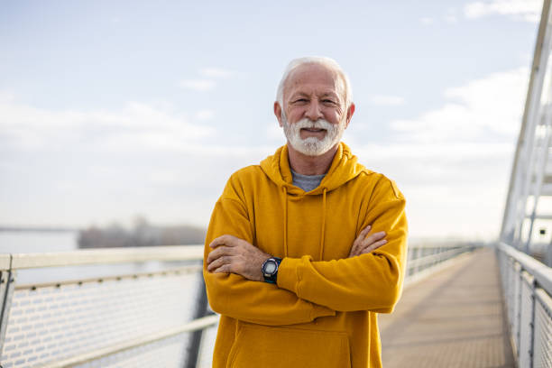 istock Portrait of smiling elderly man looking at camera 1889076715