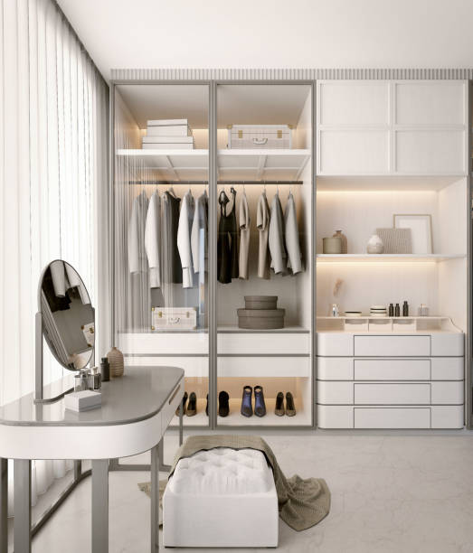 istock White luxury walk in closet interior with light frome the window.3d rendering 1889088390