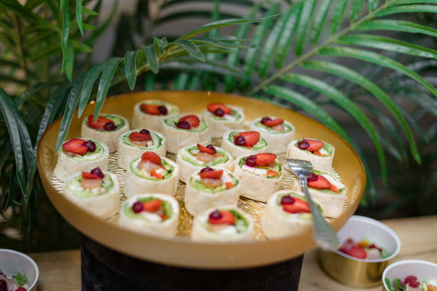 istock Candy bar. Mini cakes, desserts with whipped cream, strawberries on buffet table at festive event.. 1889179847