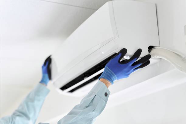 istock Asian worker inspecting air conditioner 1889238641