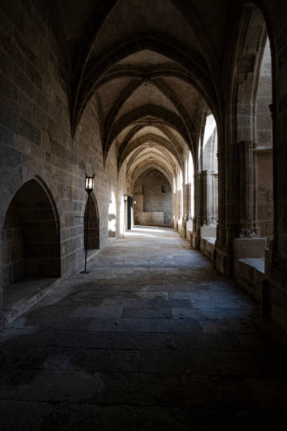 istock Interior corridor in ancient landmark building with gothic arch in a medieval architecture in Narbonne 1889261746