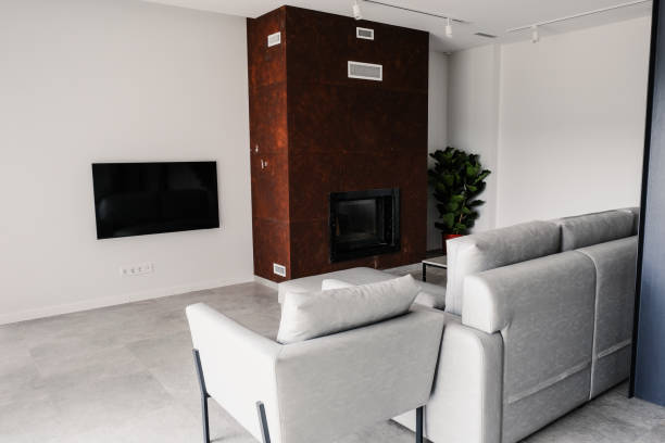 istock Spacious, bright living room with fireplace, sofa, TV. 1889324794