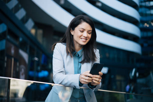 istock Young businesswoman using cell phone 1889328071