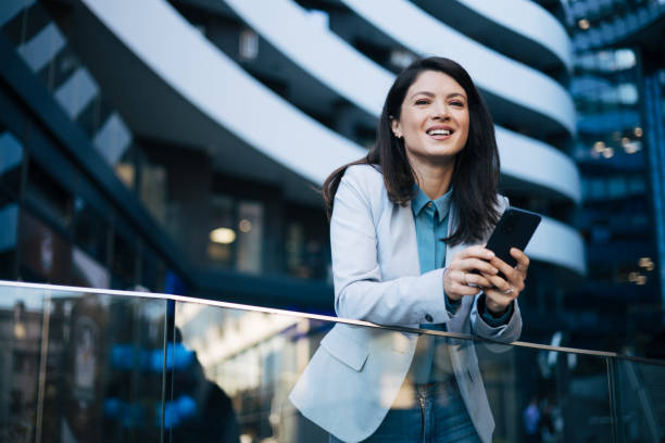 istock Young businesswoman using cell phone 1889328588